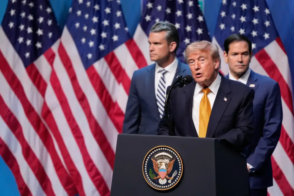 President Donald Trump speaks during a media conference, flanked by...
