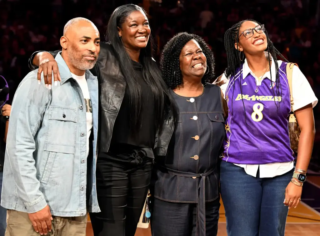 Former Sparks star DeLisha Milton-Jones, second from left, stands with...