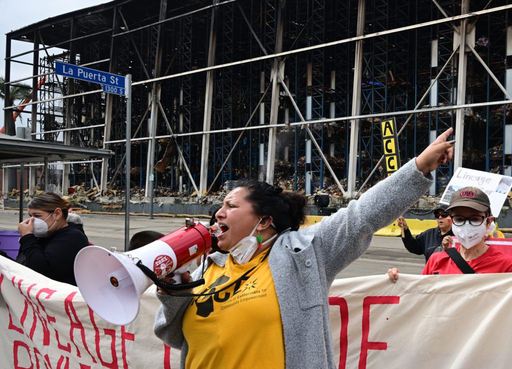 Elizabeth Hernandez uses a bullhorn. Residents and community organizations held...