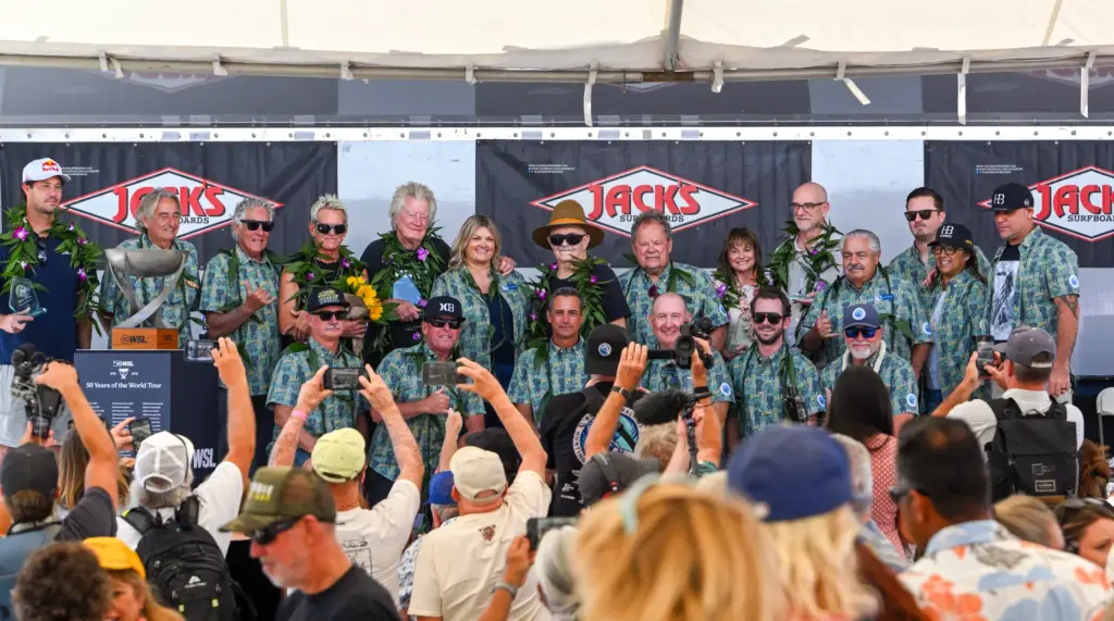 Award winners joins city officials and others on stage after...