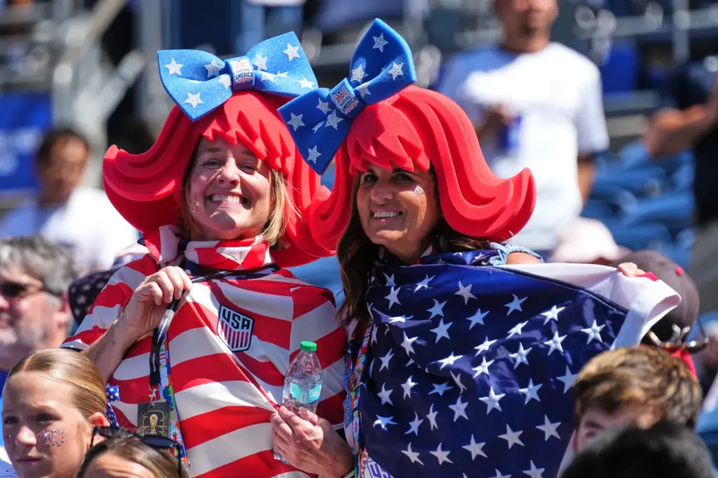 Fans of the United States pose in costumes before the...