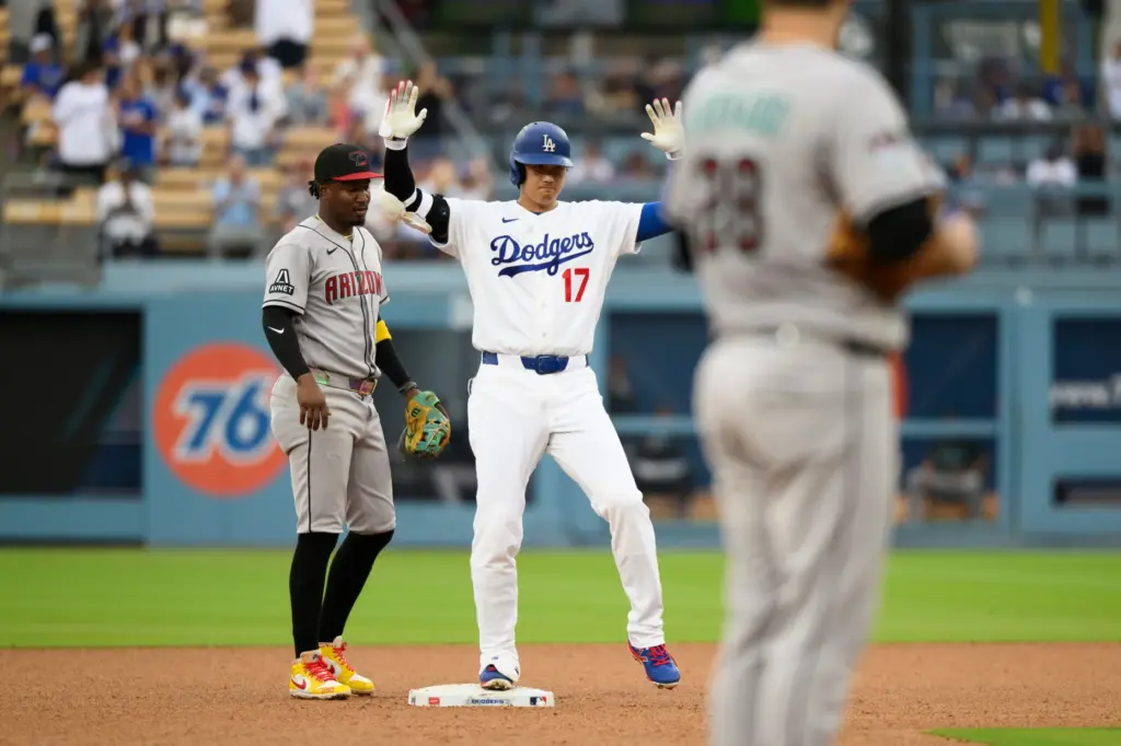 Dodgers’ Shohei Ohtani (17) celebrates after hitting a double a...
