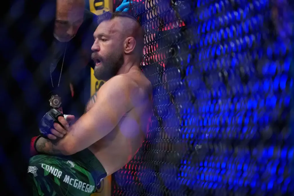 Conor McGregor reacts after losing to Max Holloway in a...