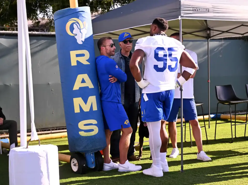 Rams’ Myles Garrett speaks to head coach Sean McVay along...