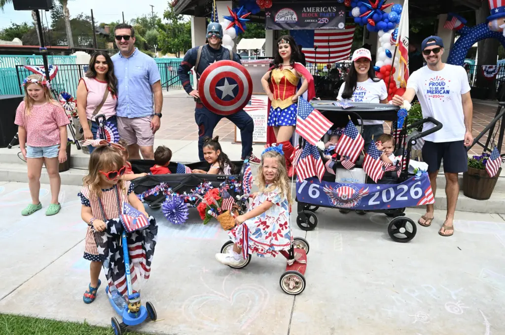 Participants in the kiddie parade pose for a photo as...