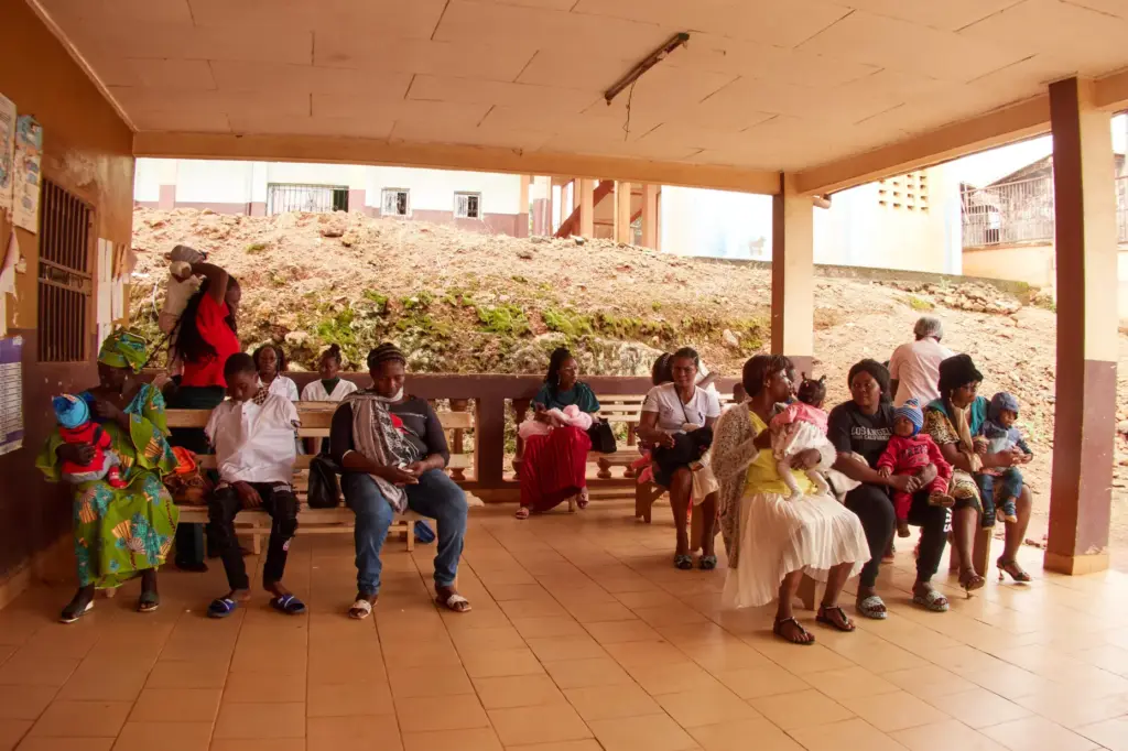 Mothers with their babies attend the malaria vaccination rollout in Cameroon.