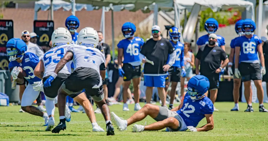 Los Angeles Rams wide receiver Puka Nacua falls to the...
