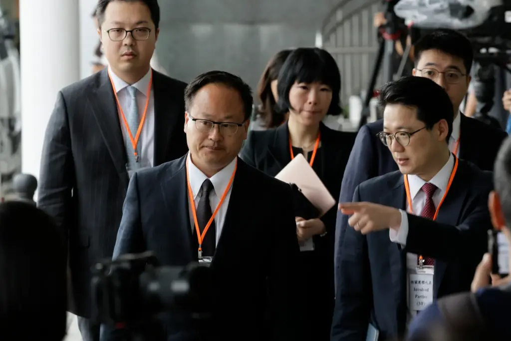 Jenkin Suen, counsel for the Hong Kong government, leaves for a lunch break.