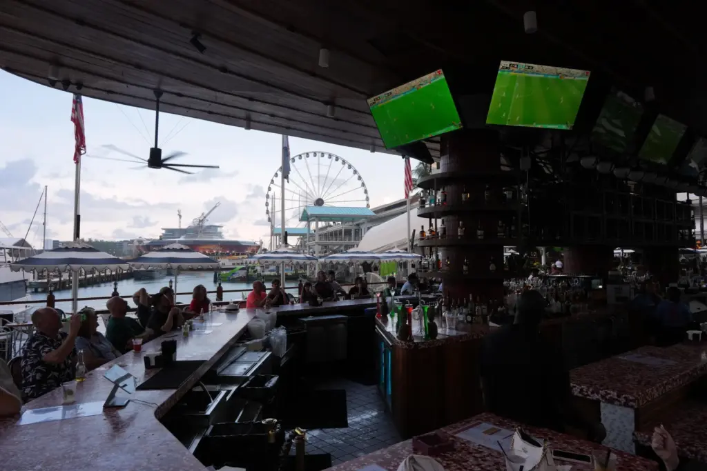 Soccer fans watch TV screens playing a World Cup match between Belgium and Senegal.
