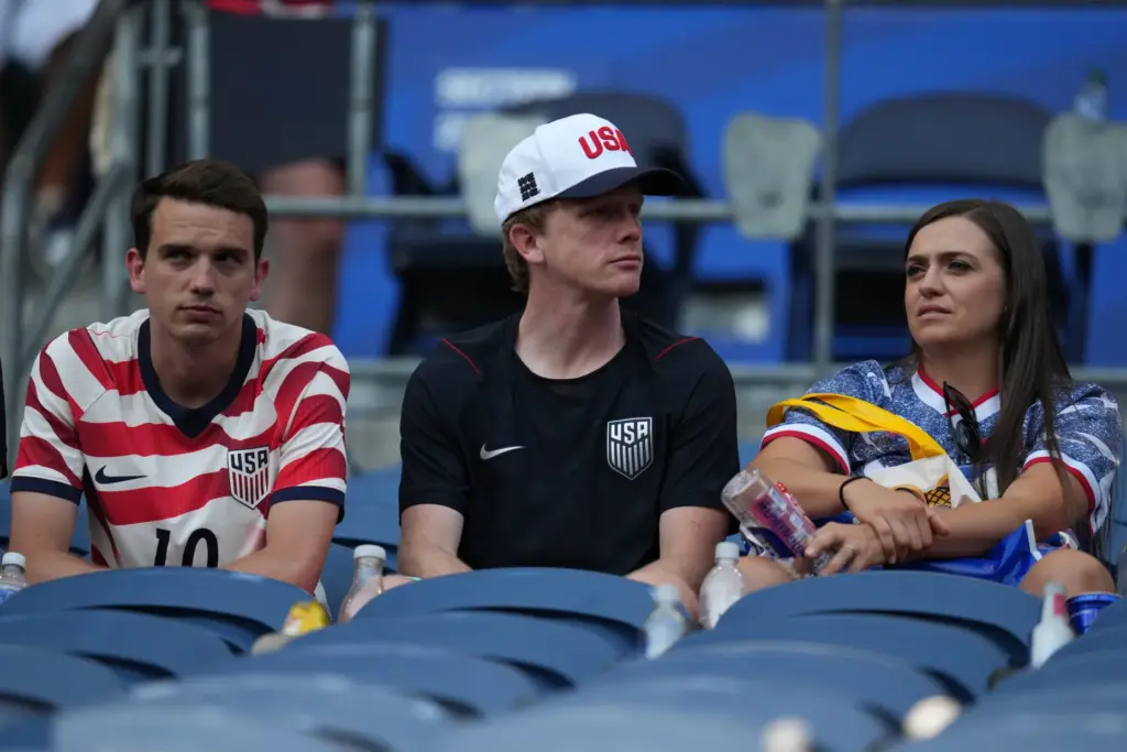 United States’ fans sit in the stands after the United...