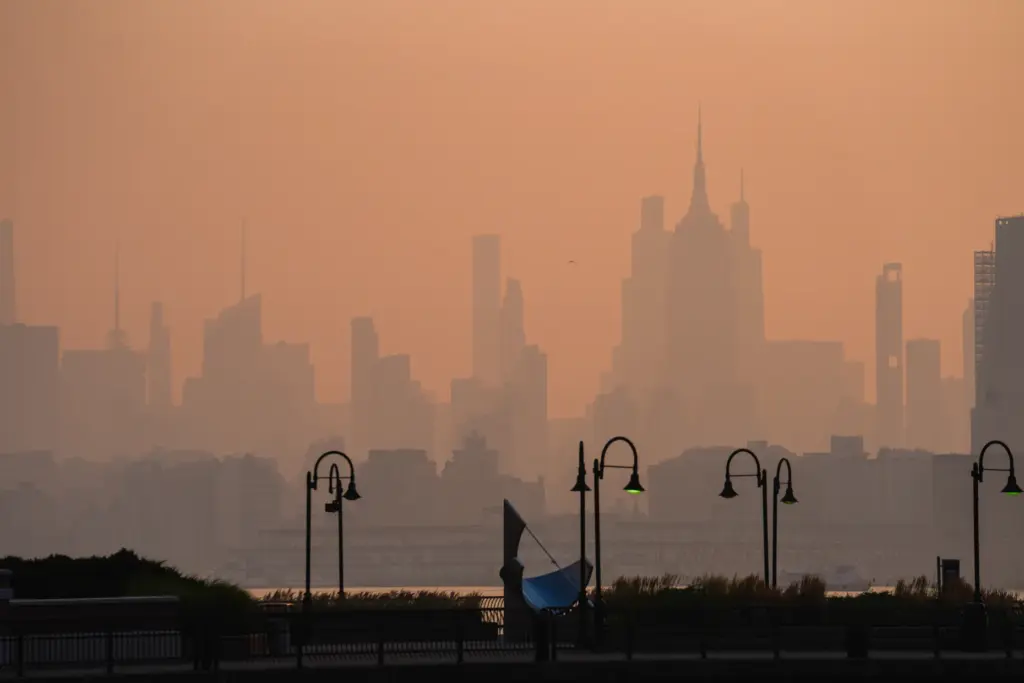 The New York City skyline is seen through a cover of wildfire smoke.
