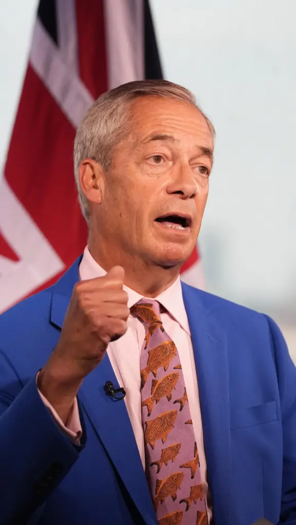 Reform UK leader Nigel Farage makes a statement to the media.