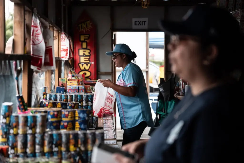 Volunteers Laurene Cardoza, foreground, and Jennifer Aragon work at a...