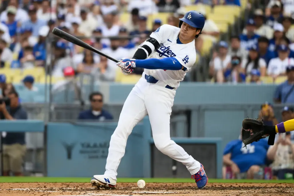 Dodgers’ Shohei Ohtani hits a ground ball during the fifth...
