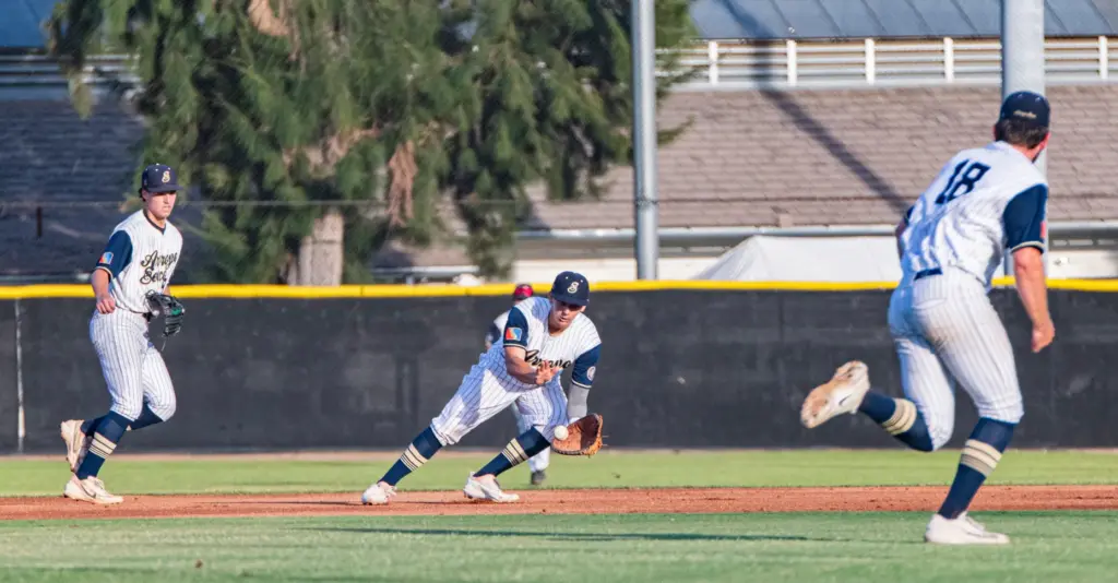 Arroyo Seco Saints Paul Lizzul fields a ground ball while...