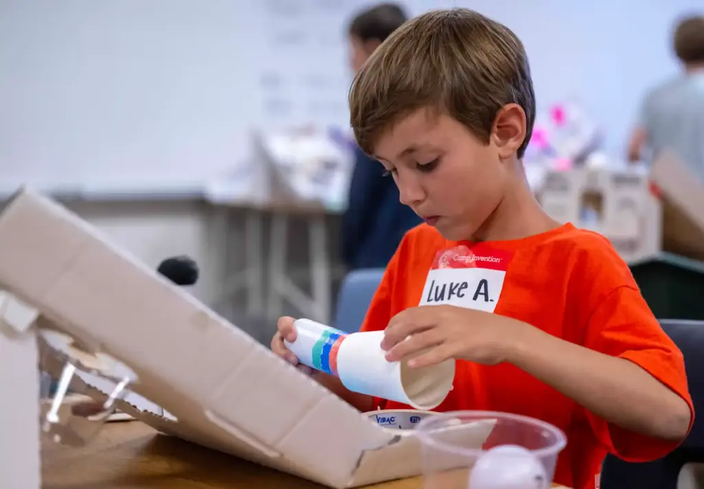 Luke Andrew, 7, of Ladera Ranch works on creating a...