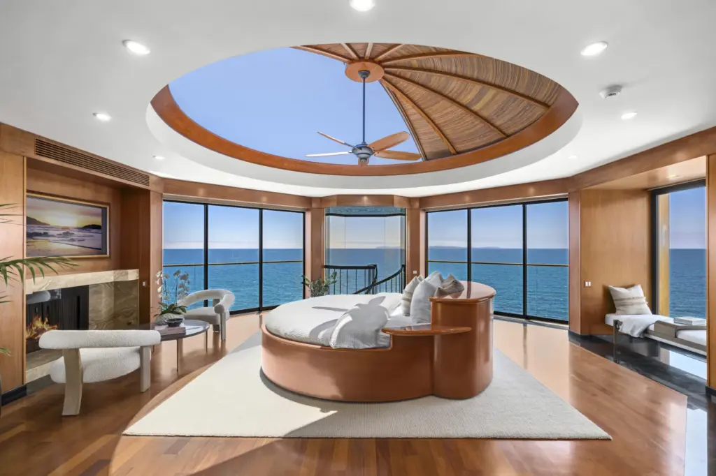 The primary bedroom has a retractable ceiling above a rotating...
