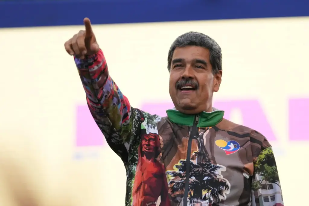 Venezuelan President Nicolas Maduro points to supporters during a campaign rally.
