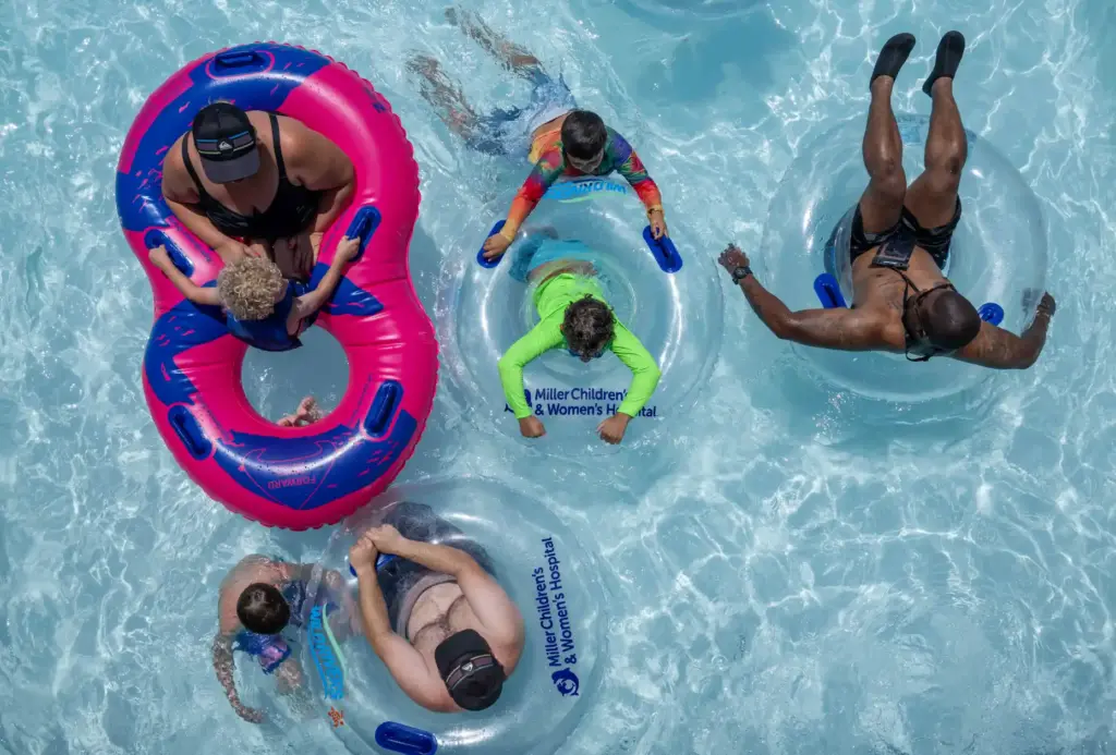 Families cool off as they float down the Castaway River...