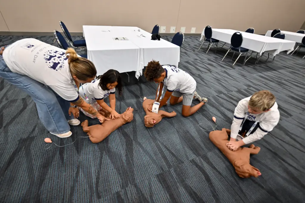 Jordan Howell teaches Ariella Topliff Lee, left, and Trenton Connor,...
