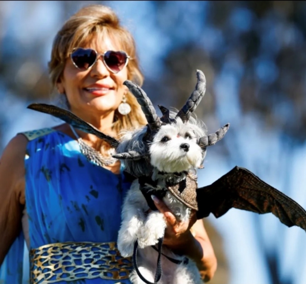 Poway resident Mary Caraway and her dog, Madison, dressed as...