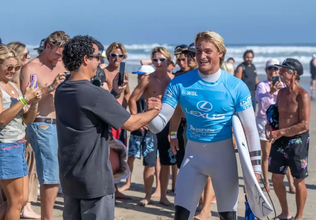 Huntington Beach local Luke Guinaldo is greeted by fans as...
