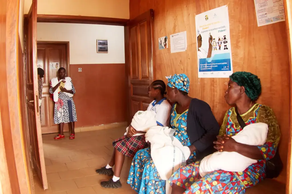 Mothers with their babies attend the malaria vaccination rollout in Cameroon.
