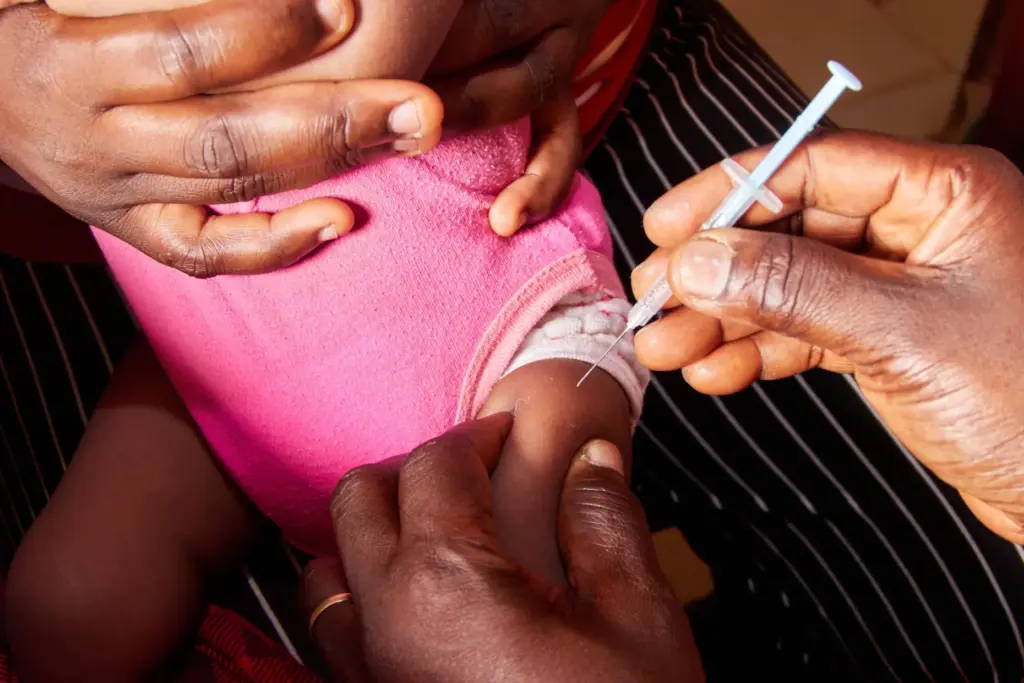 A baby receives a malaria vaccine at the Soa District Hospital in Yaounde, Cameroon.
