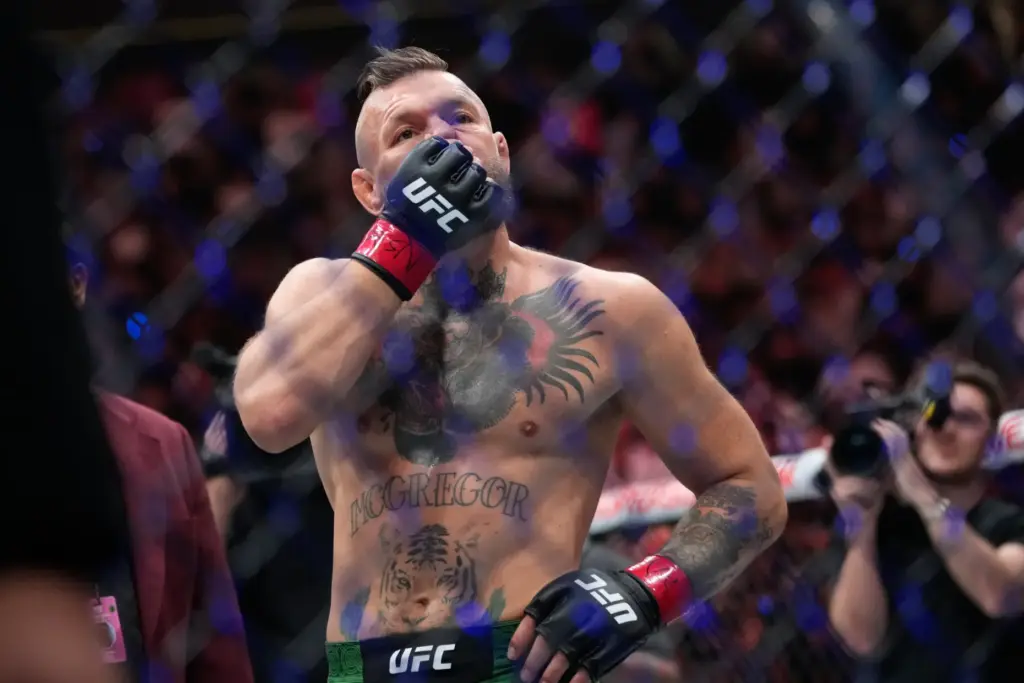 Conor McGregor reacts after losing to Max Holloway in a...
