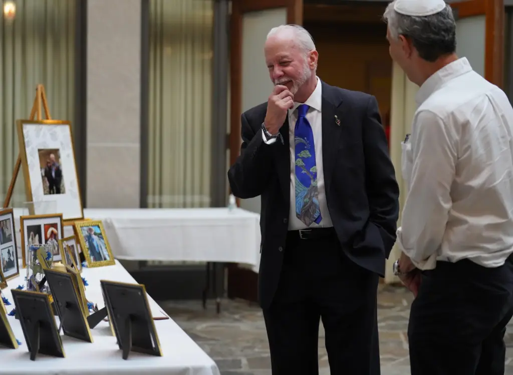 Rabbi Jeffrey Myers of the Tree of Life Congregation, left,...