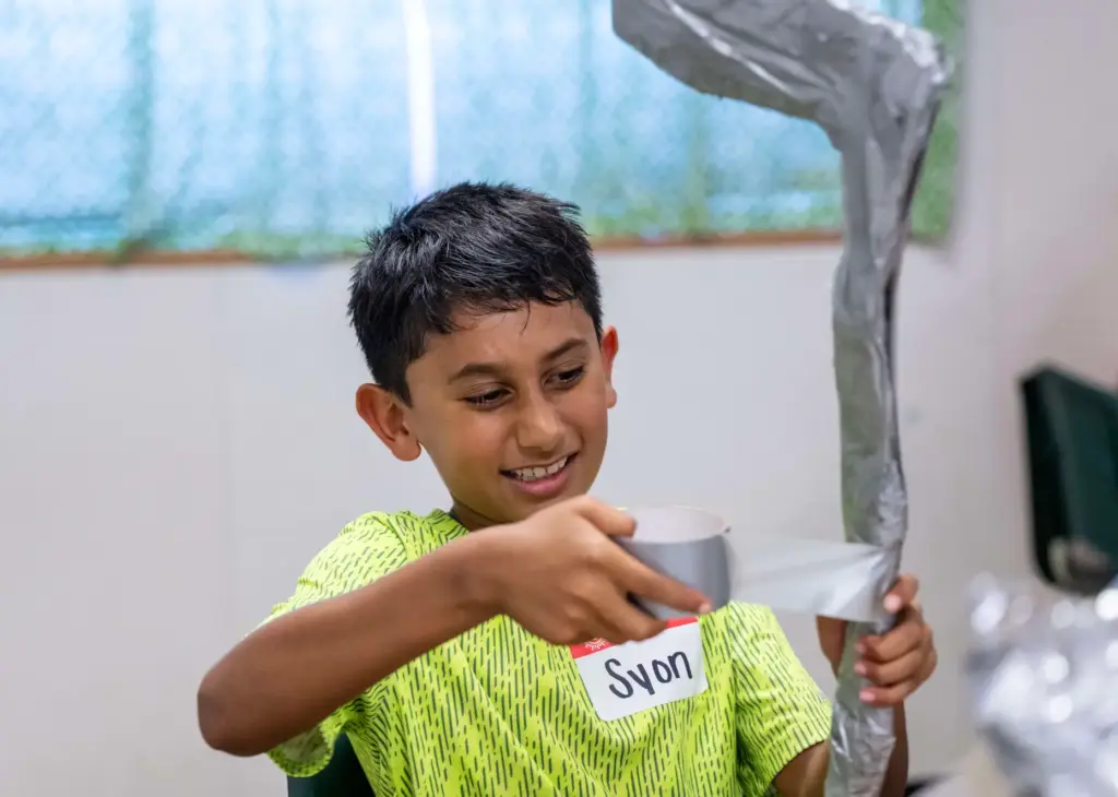 Syon Sheth, 10, of Ladera Ranch uses duct tape to...