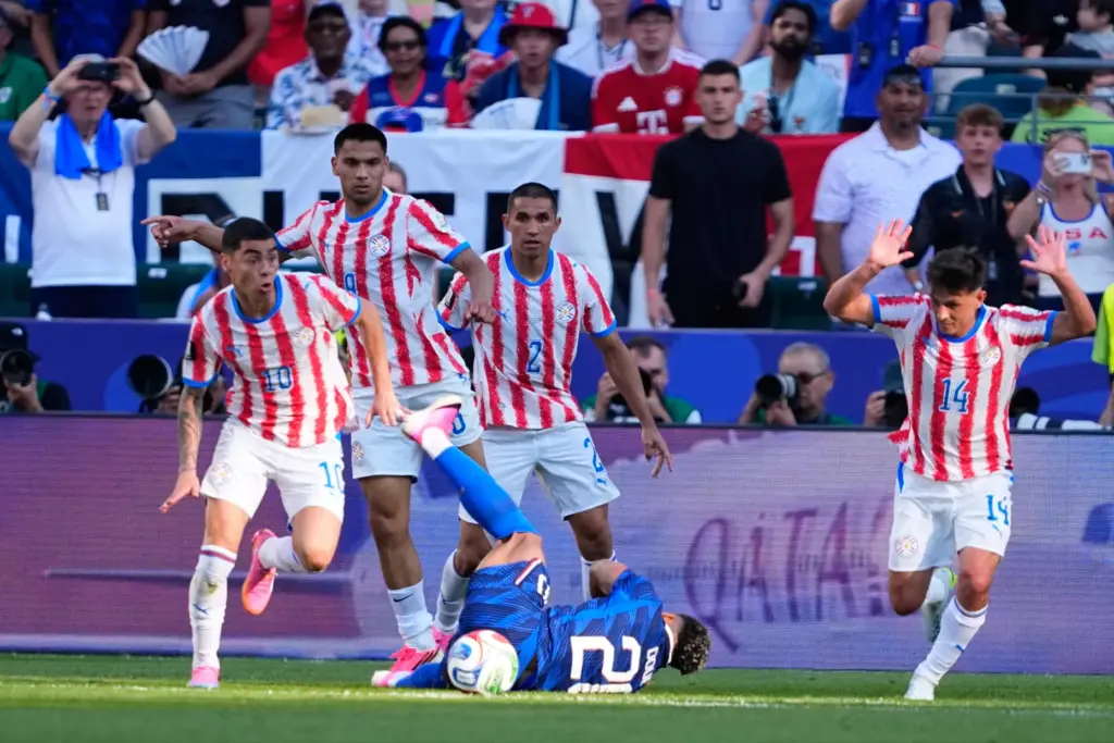Paraguay’s Miguel Almiron (10) controls the ball as France’s Desire...