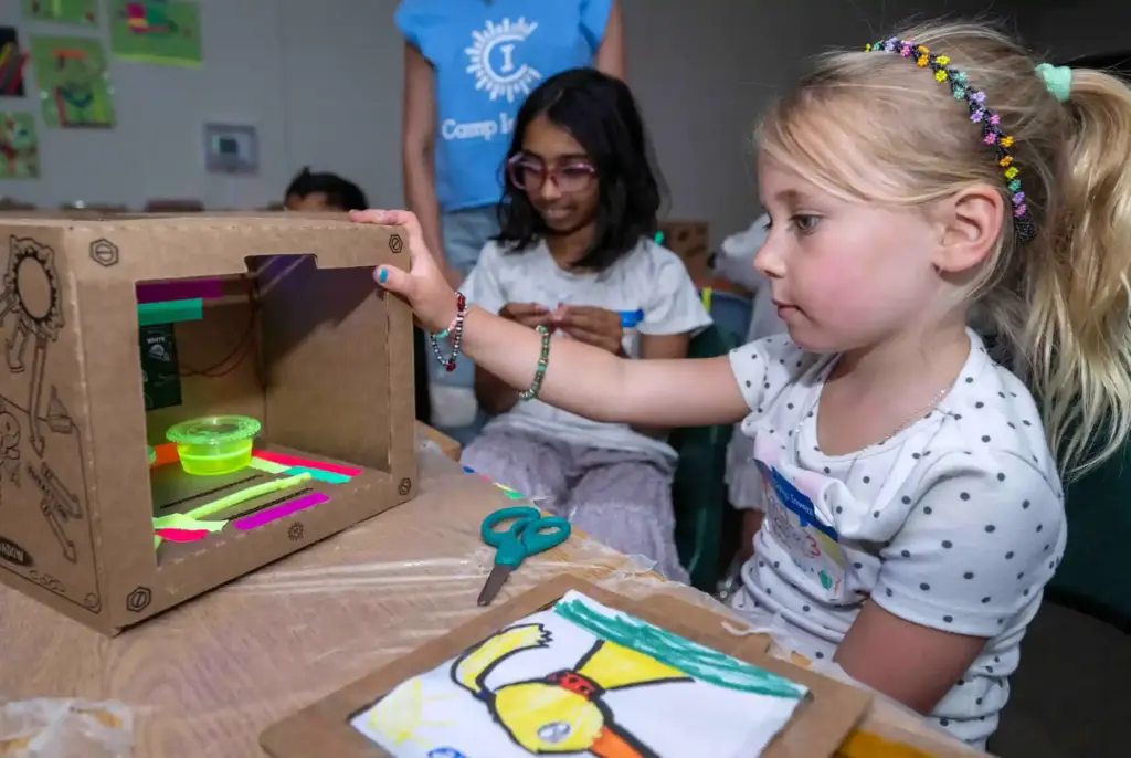 Cora Butterfield, 6, of Ladera Ranch works on creating a...