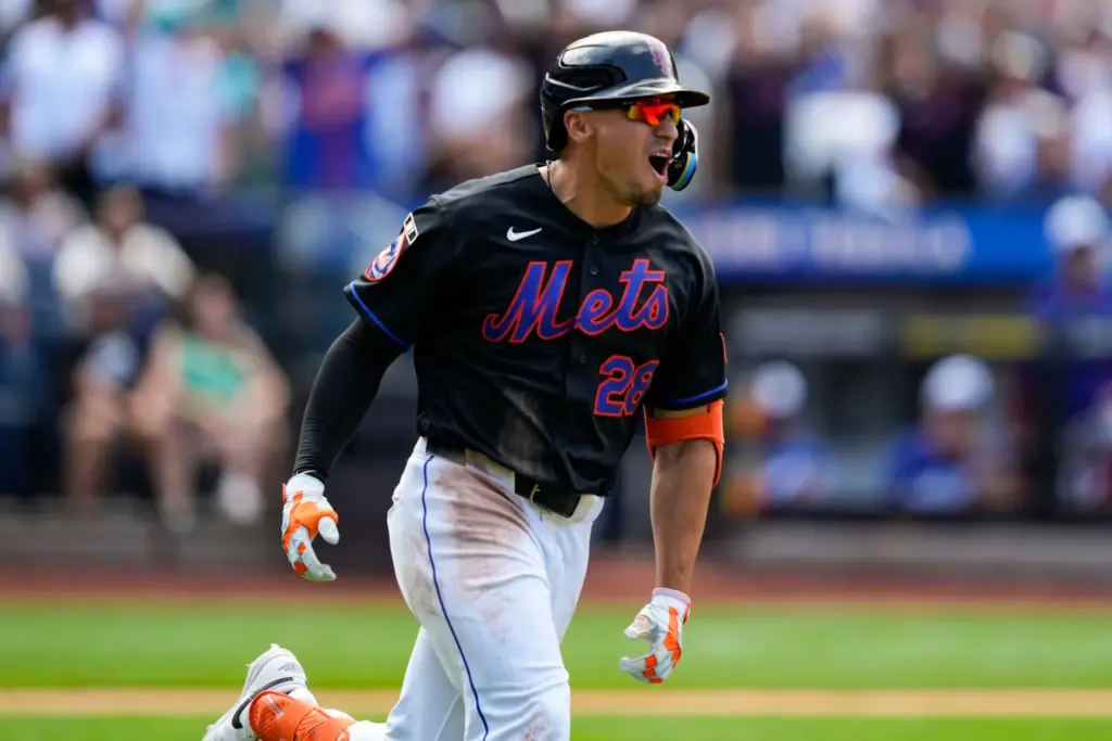 New York Mets’ Tyrone Taylor reacts after hitting a three-run...