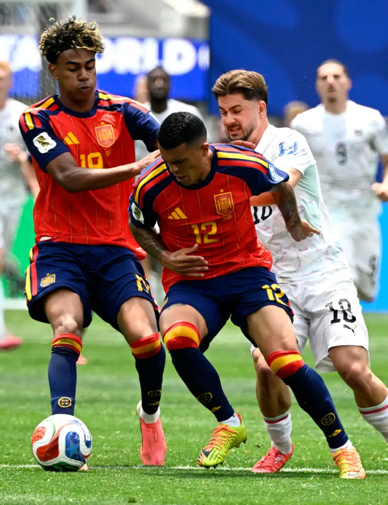 Spain forward Lamine Yamal (19) and Spain defender Pedro Porro...