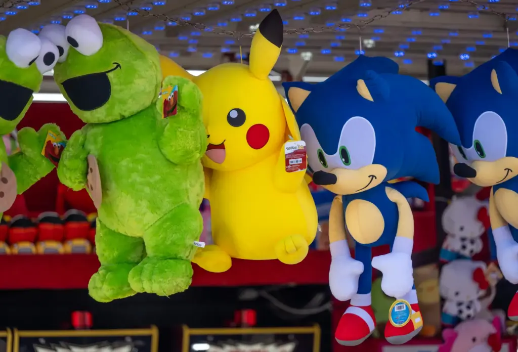 Stuffed animal prizes, including Cookie Monster, Pikachu and Sonic the...