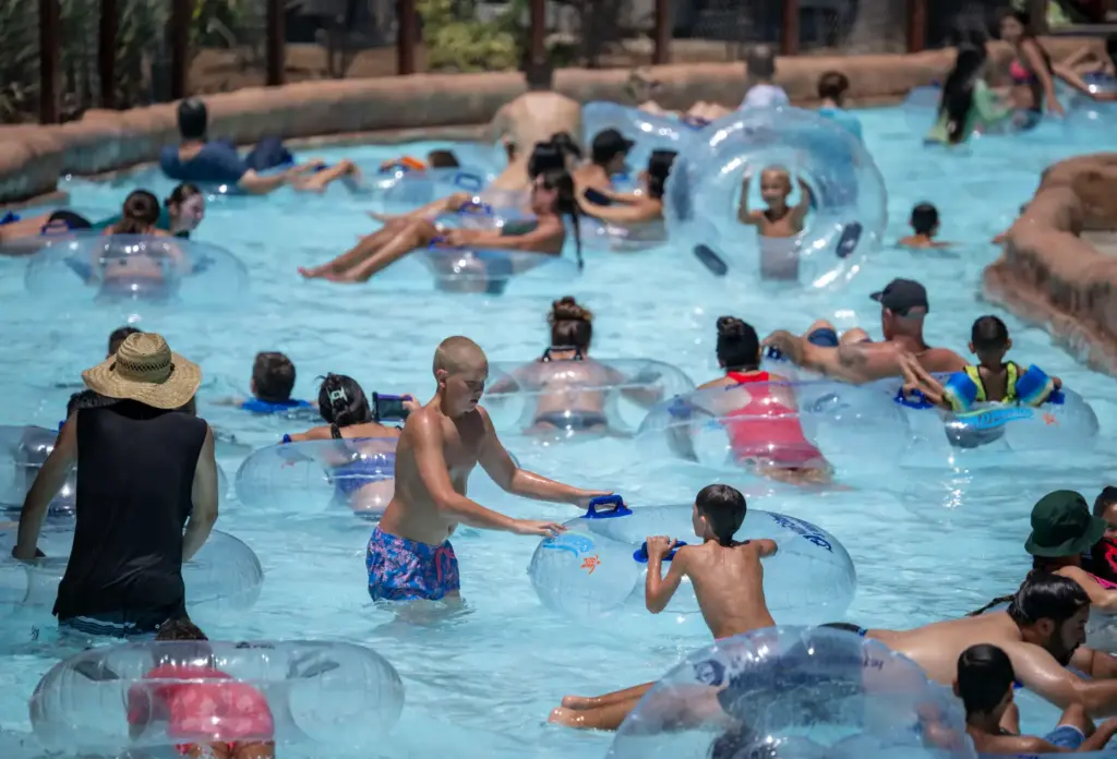 Families cool off as they float down the Castaway River...