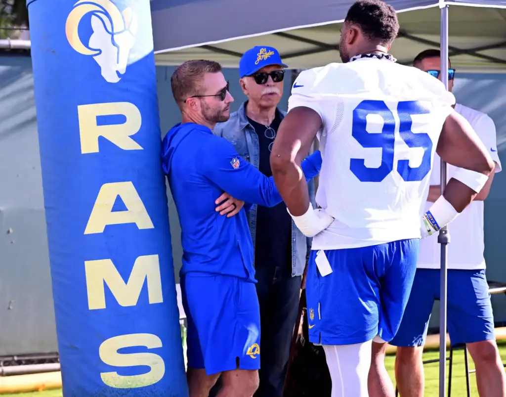 Rams edge rusher Myles Garrett speaks with head coach Sean...