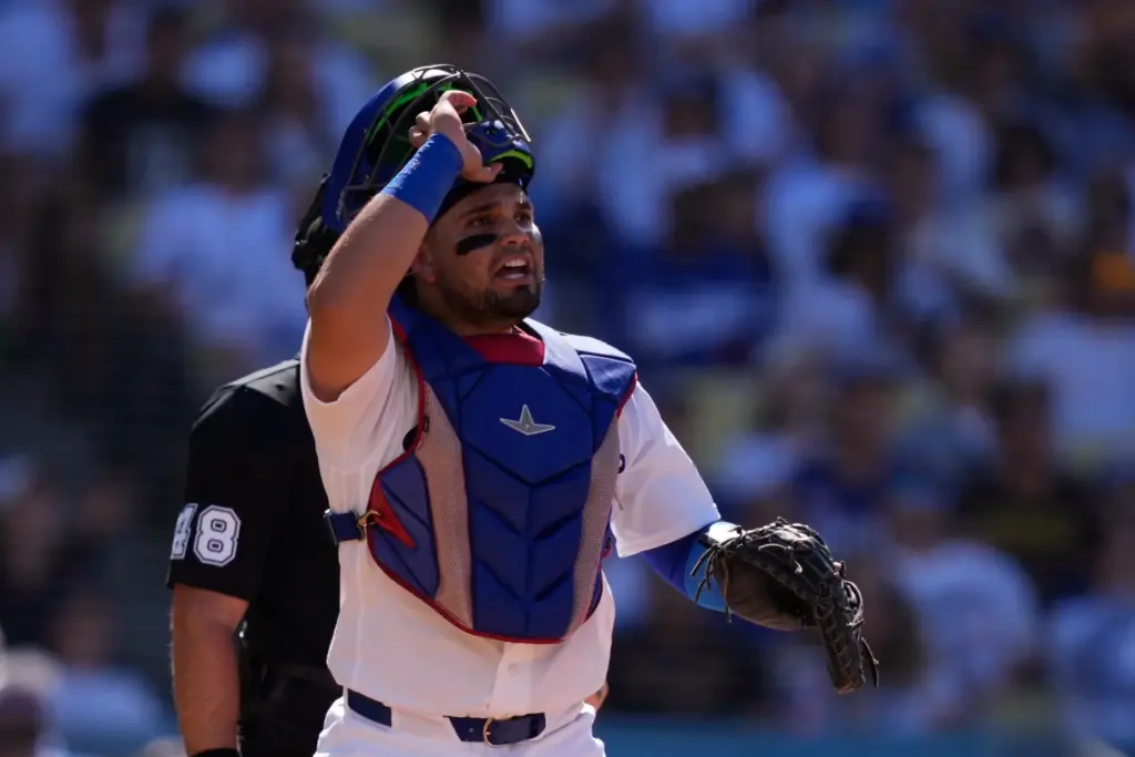 Dodgers catcher Eliezer Alfonzo watches as San Diego Padres’ Manny...