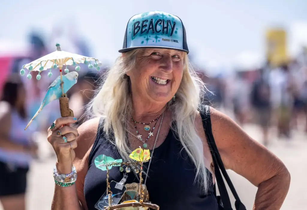 Lori Pate of Huntington Beach walks with her bird, Beachy,...