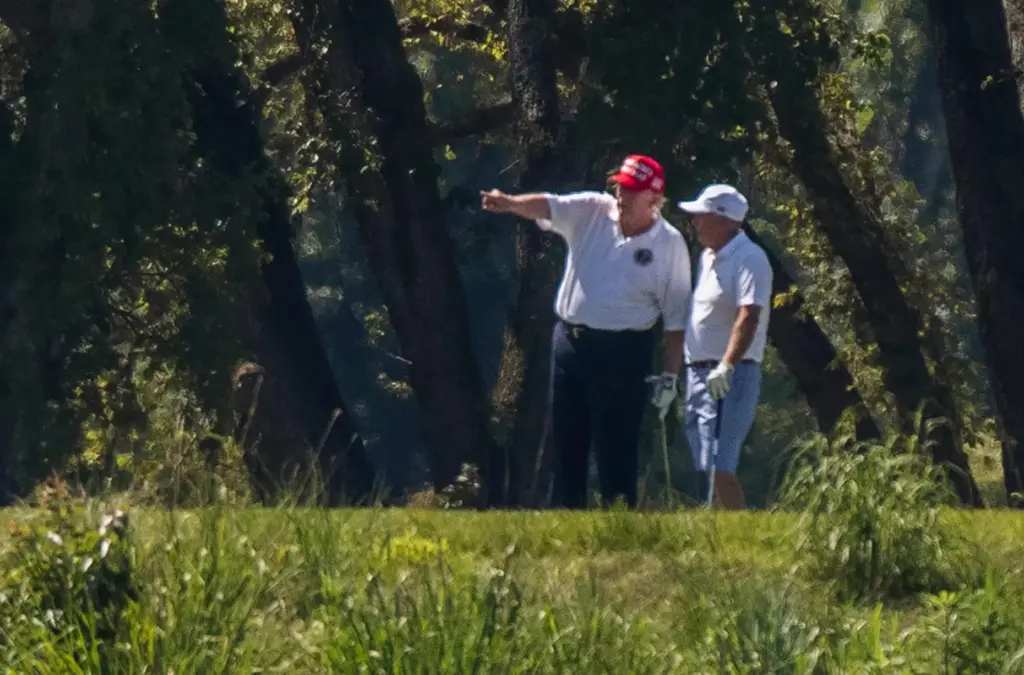 FILE – President Donald Trump and Sen. Lindsey Graham, R-S.C.,...