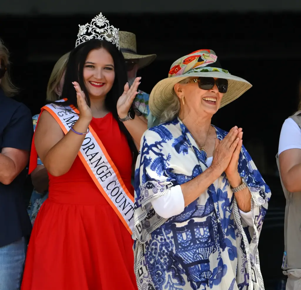 Miss Orange County, Lainie Shield, applauds as Yvonne Winter, the...
