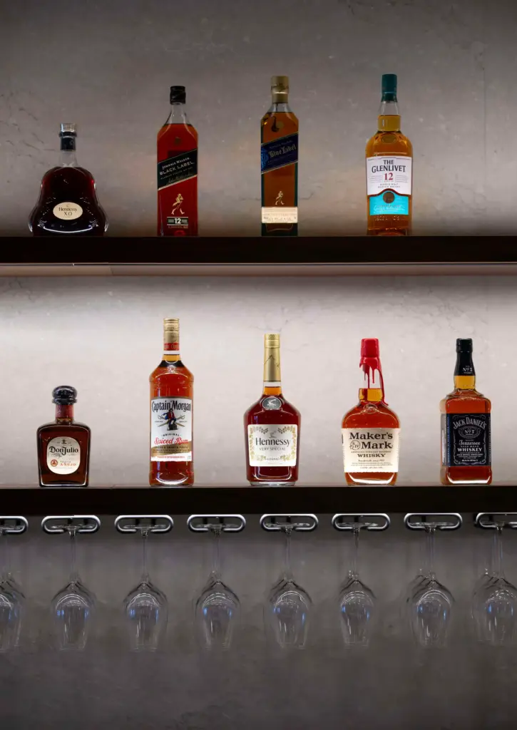 Bottles of liquor are displayed at the bar of Din...