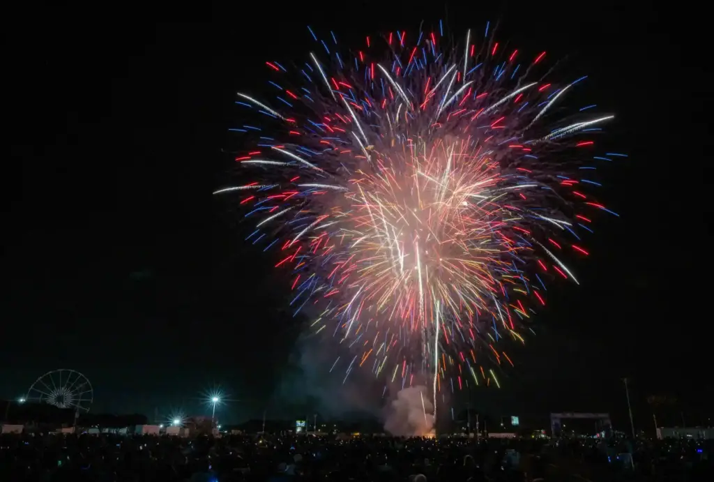 Fireworks explode over the OC Fair Event Center in Costa...