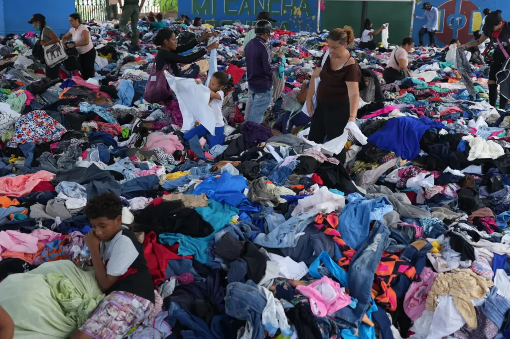 People choose clothes donated to those affected by the earthquakes.