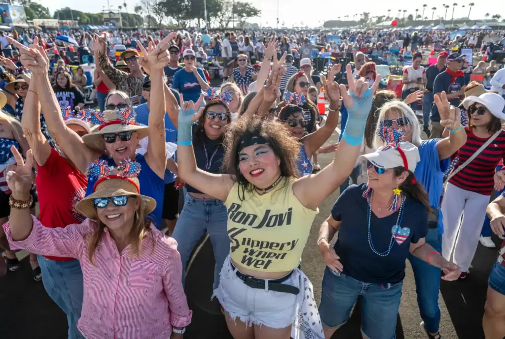 Maddie Parr, center, of Irvine, an 80âs music enthusiast, dances...