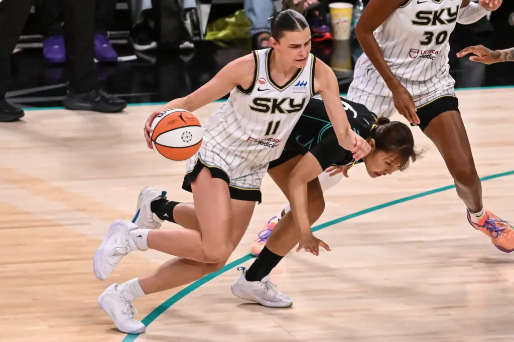 Chicago Sky rookie Gabriela Jaquez, left, drives past the Sparks’...