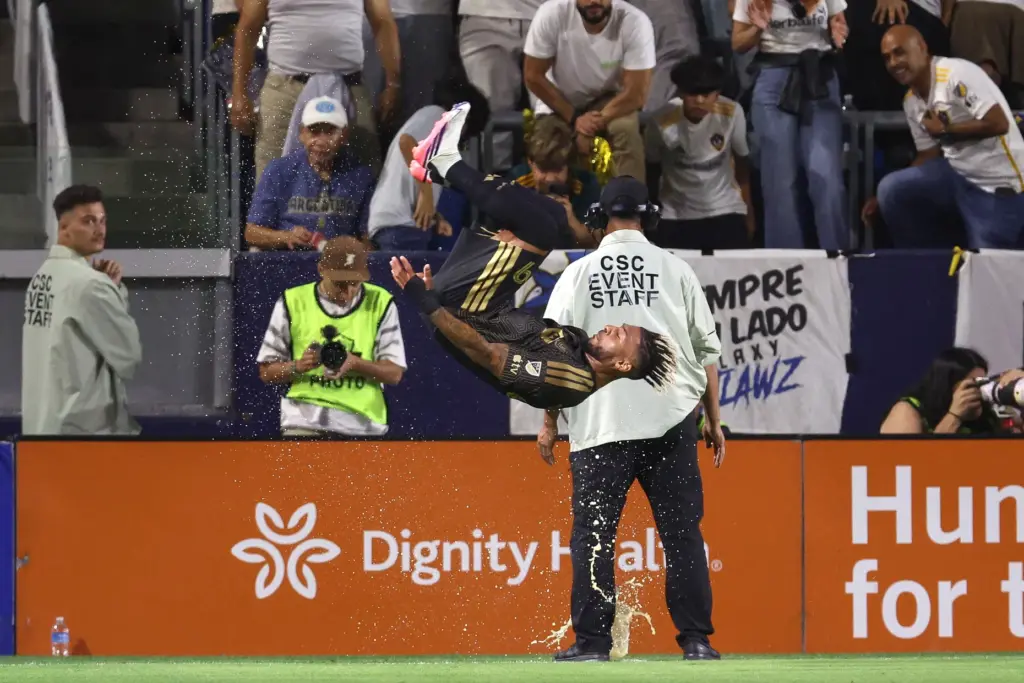 LAFC forward Denis Bouanga (99) performs a standing flip after...