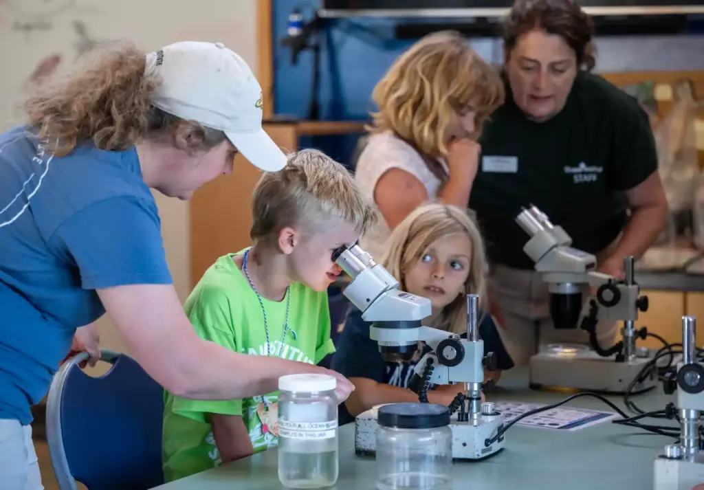 Laura Sanborn, left, a camp counselor at the Ocean Institute,...