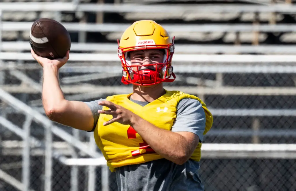 Mission Viejo High School quarterback Brett Burnor practices with the...